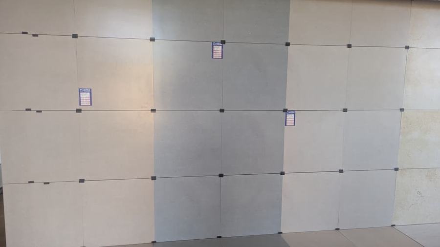 Floor and wall tile display at Aura Investments Uganda