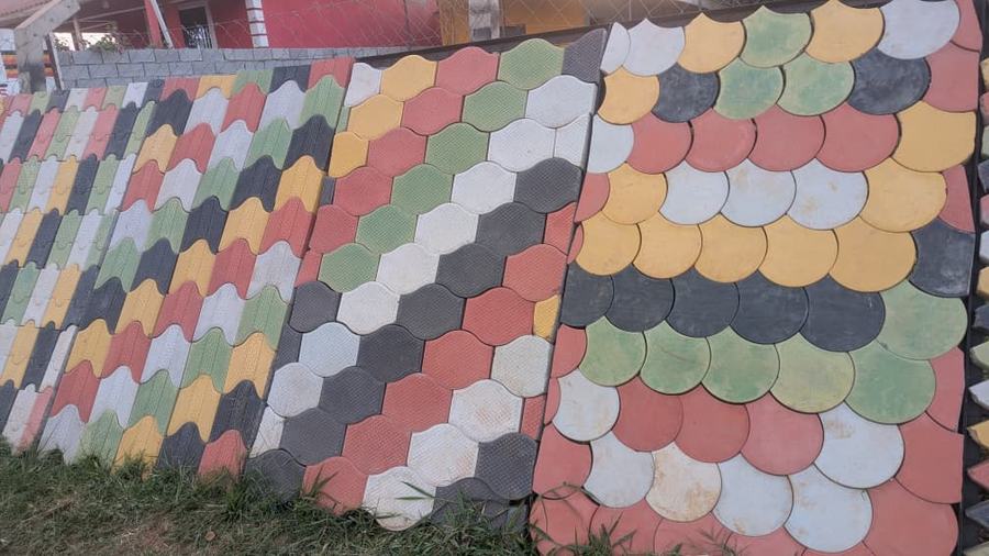 Outdoor paver display and pavement samples at Aura Investments Kampala